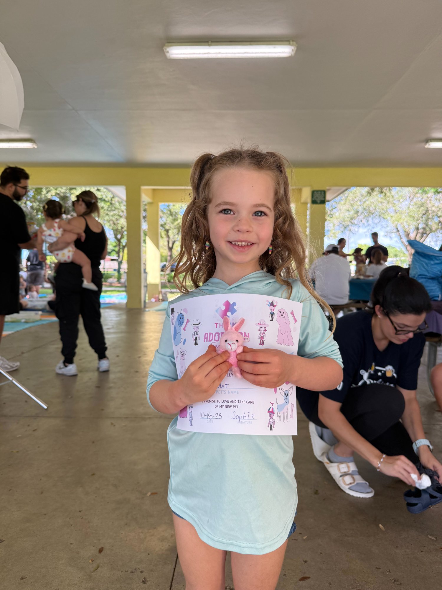 Girl with pet adoption certificate
