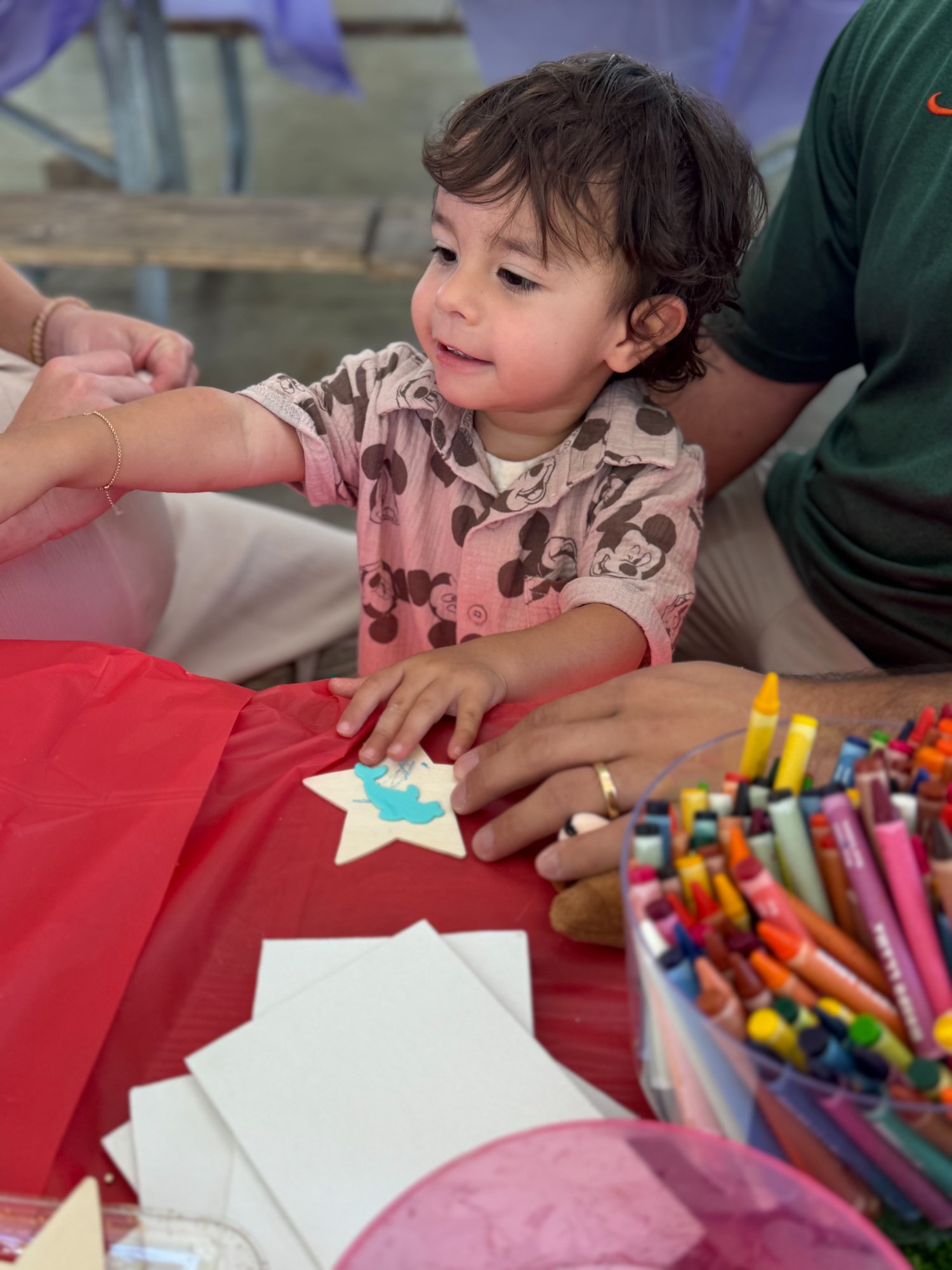 Child doing arts and crafts at Think! Brain Zone community event