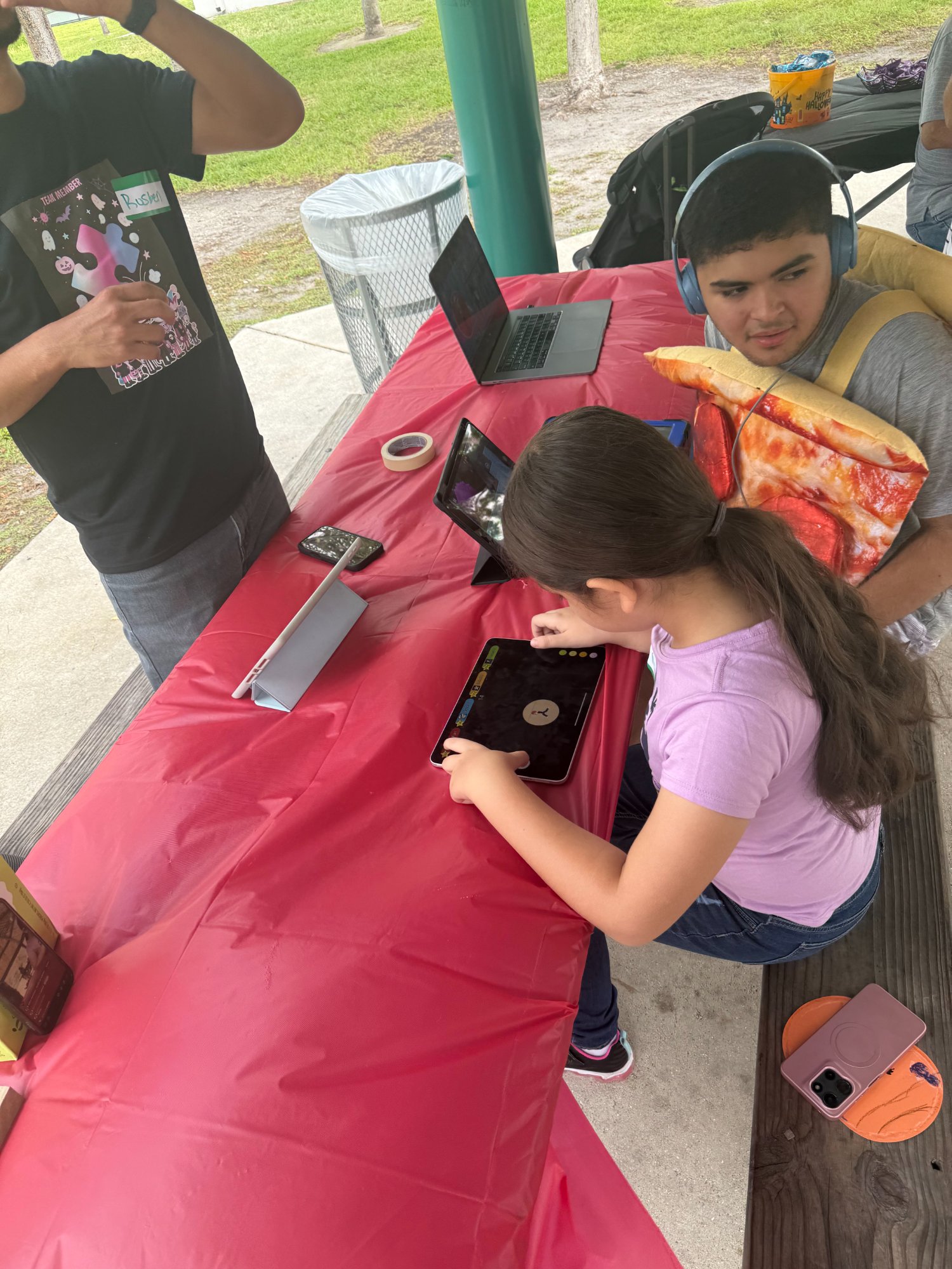 Children playing games at outdoor event table