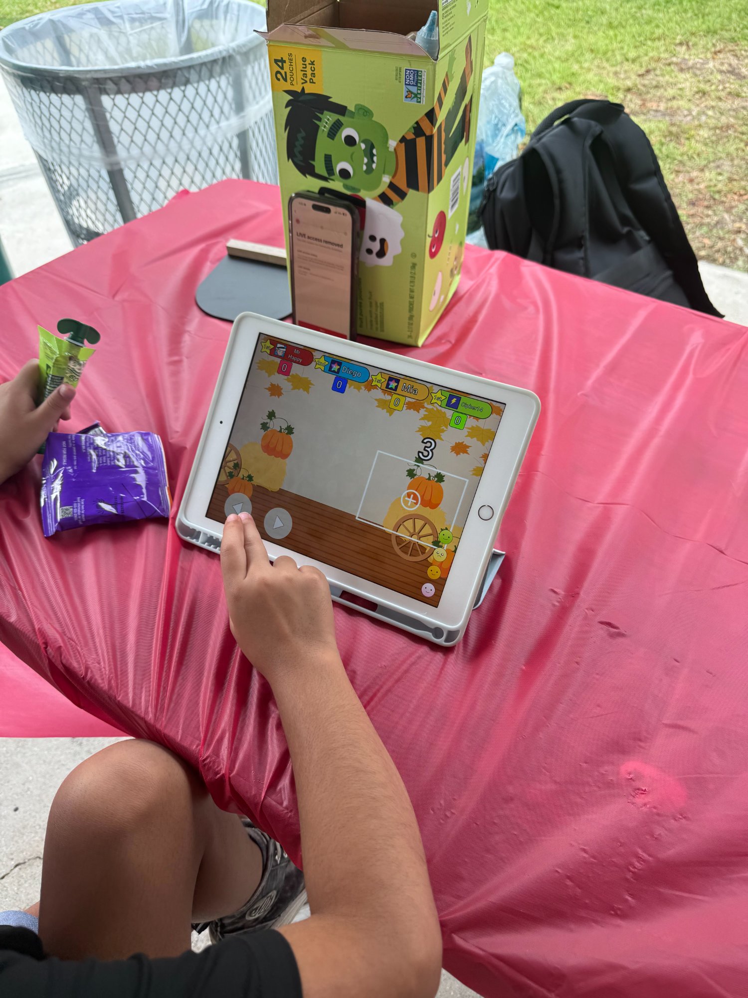 Child playing pumpkin-themed Think! game