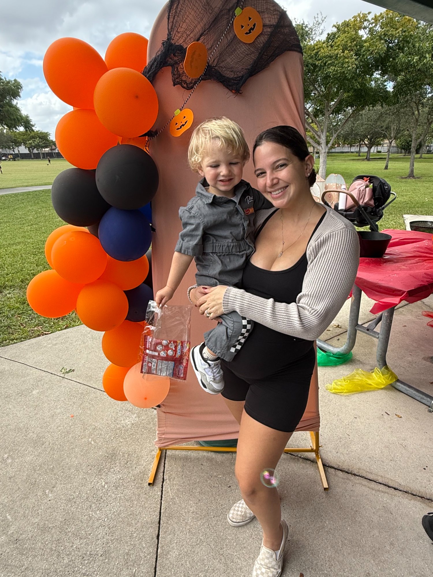 Young boy with mother holding prize