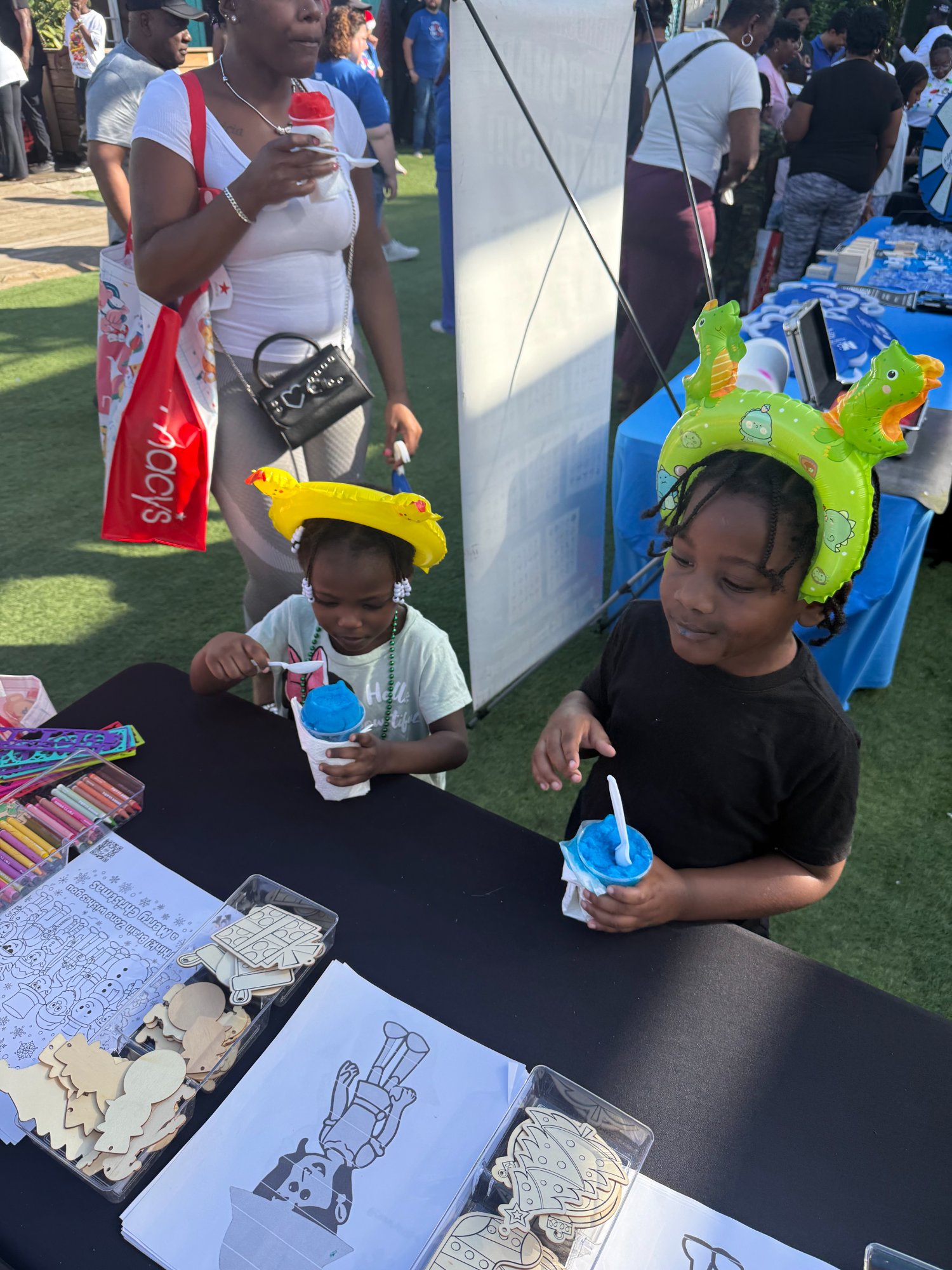 Children enjoying treats at community event