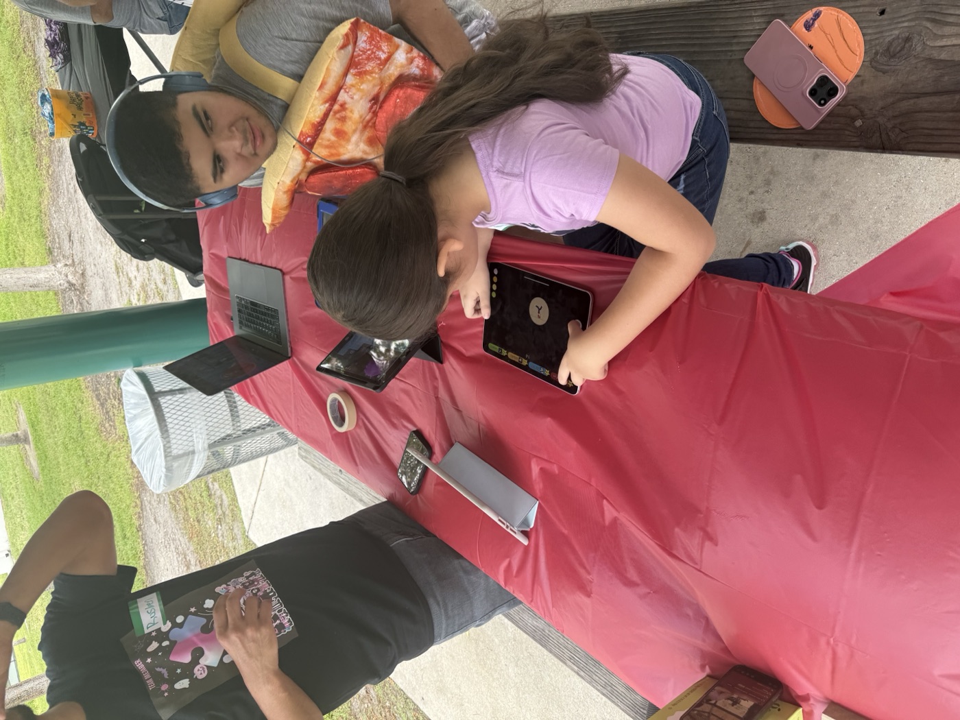 A child explores our interactive game station during one of our free outdoor eve