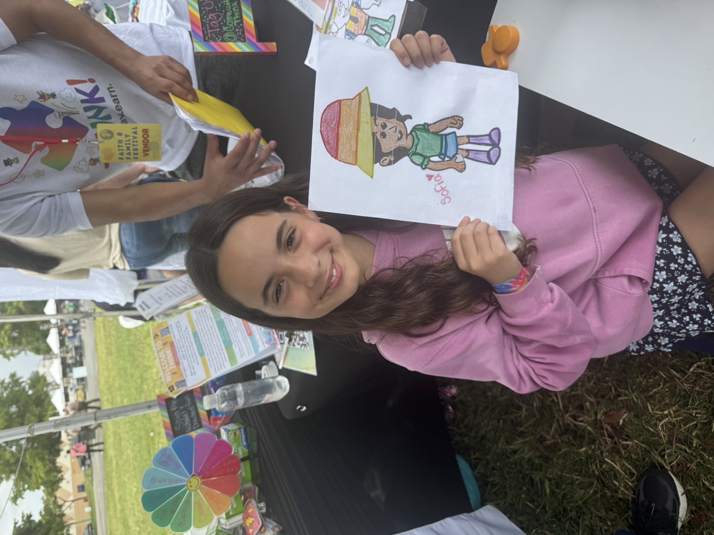Learning is more fun when you do it together — two kids paint side by side at ou