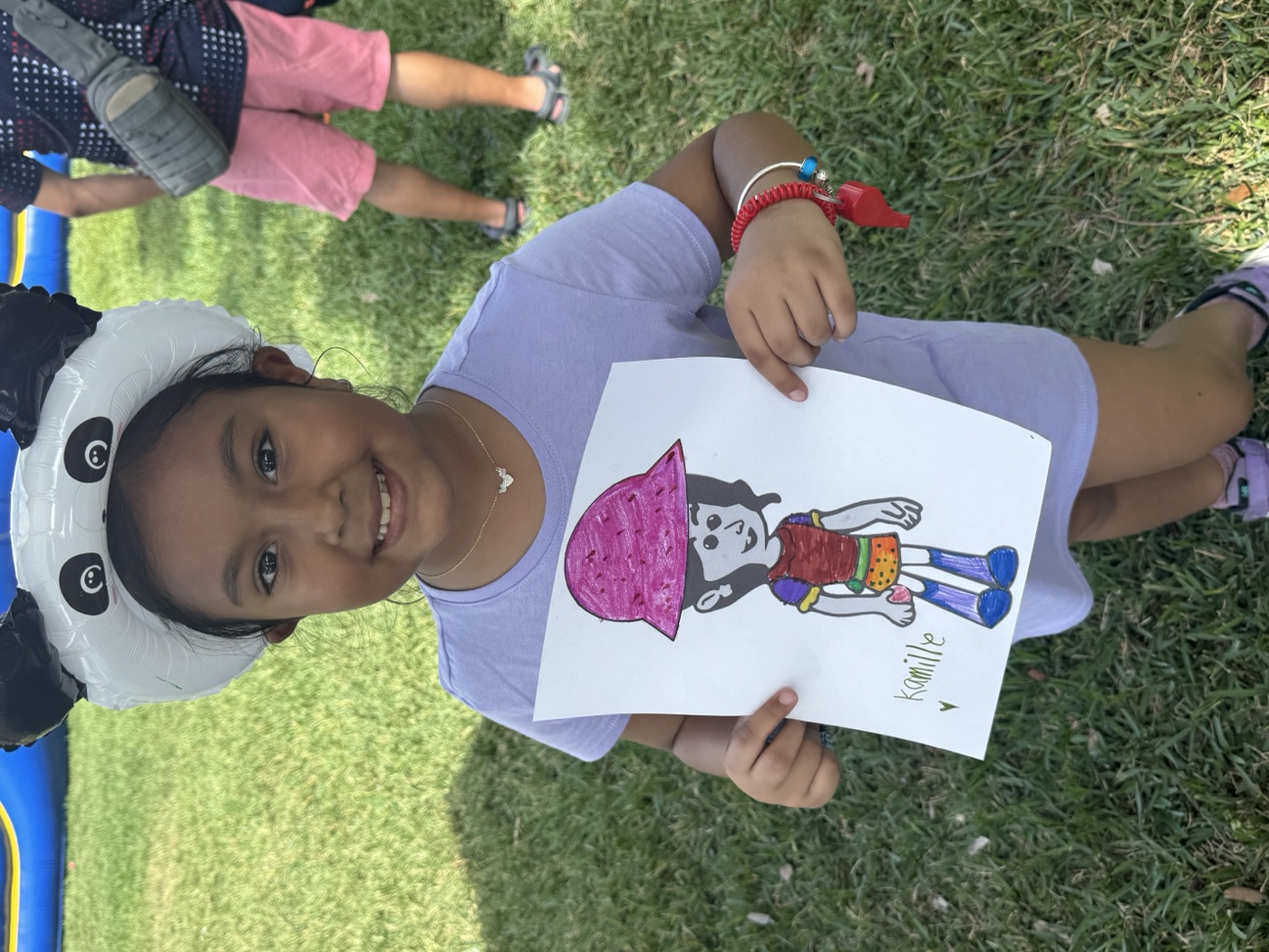 Teamwork on a giant canvas — kids collaborate on a big art project at our outdoo