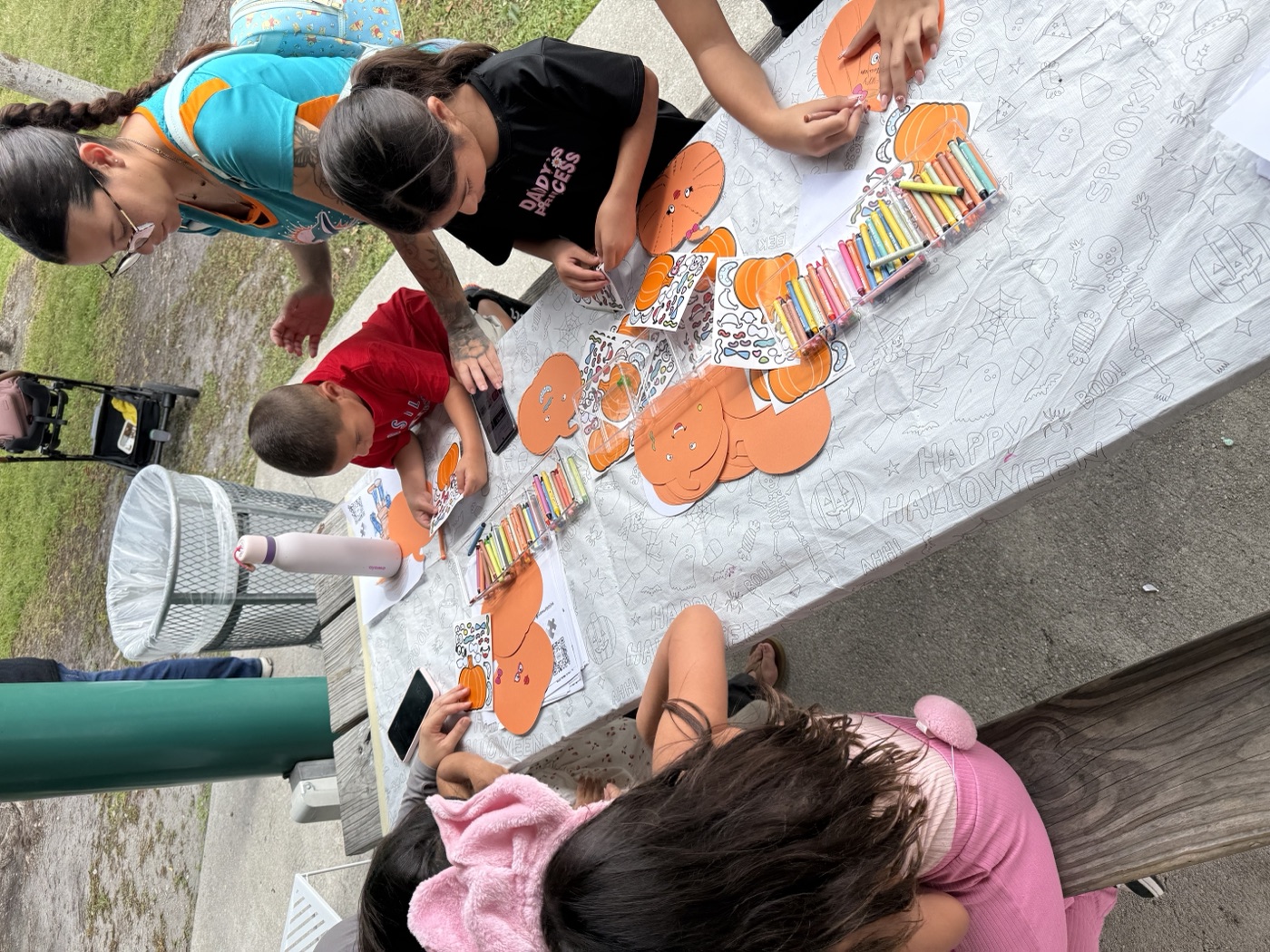 A parent and child share a sweet learning moment together at our craft station.