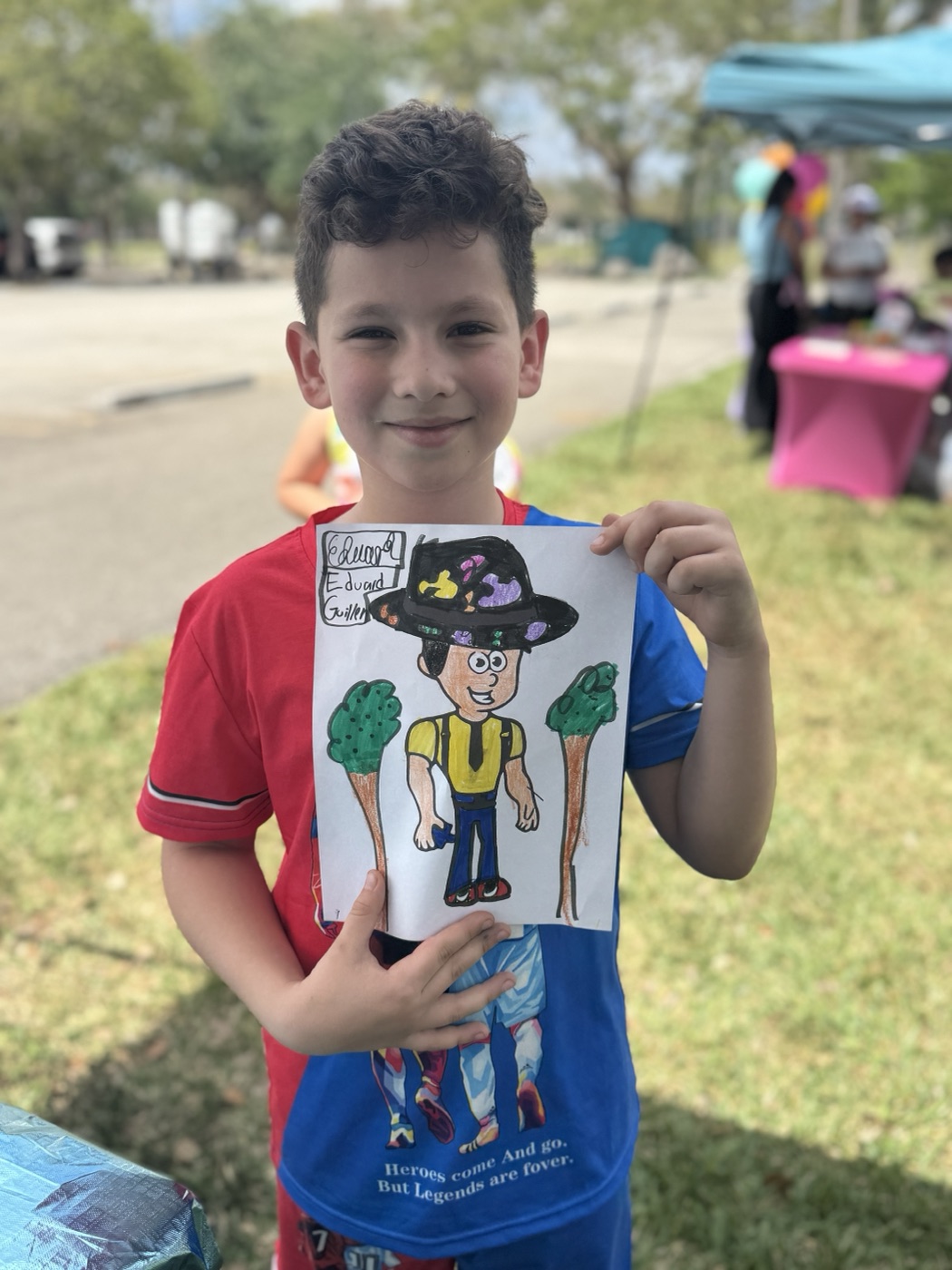 This happy artist couldn't wait to show everyone what they made. Pure joy!
