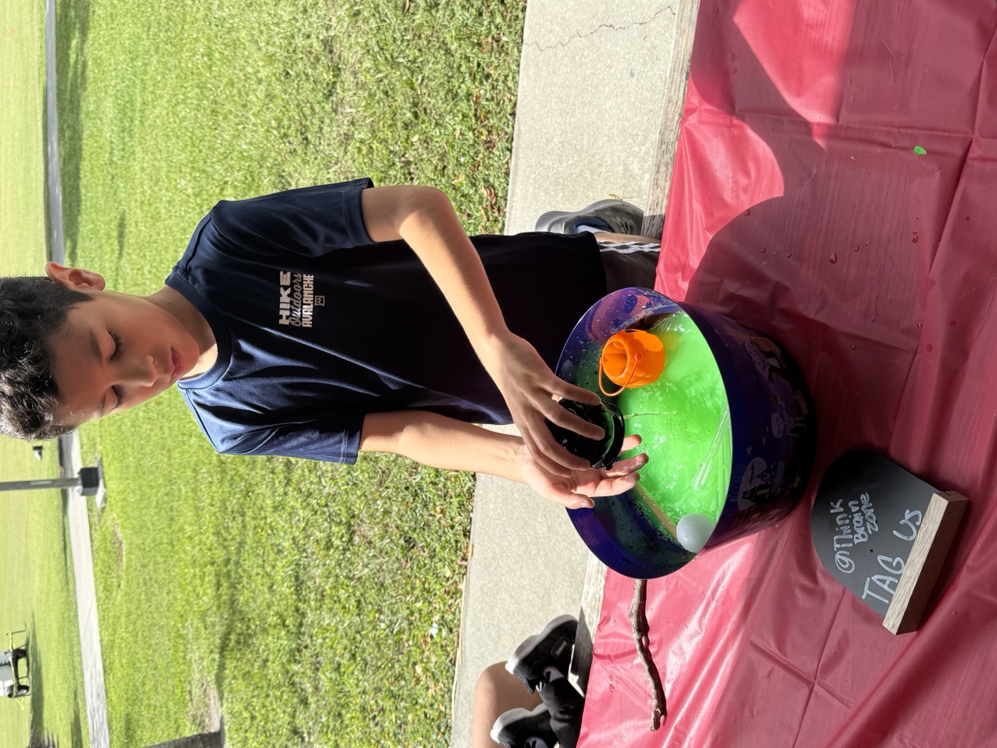 The ball pit adventure awaits! A child dives into sensory play at our event tent