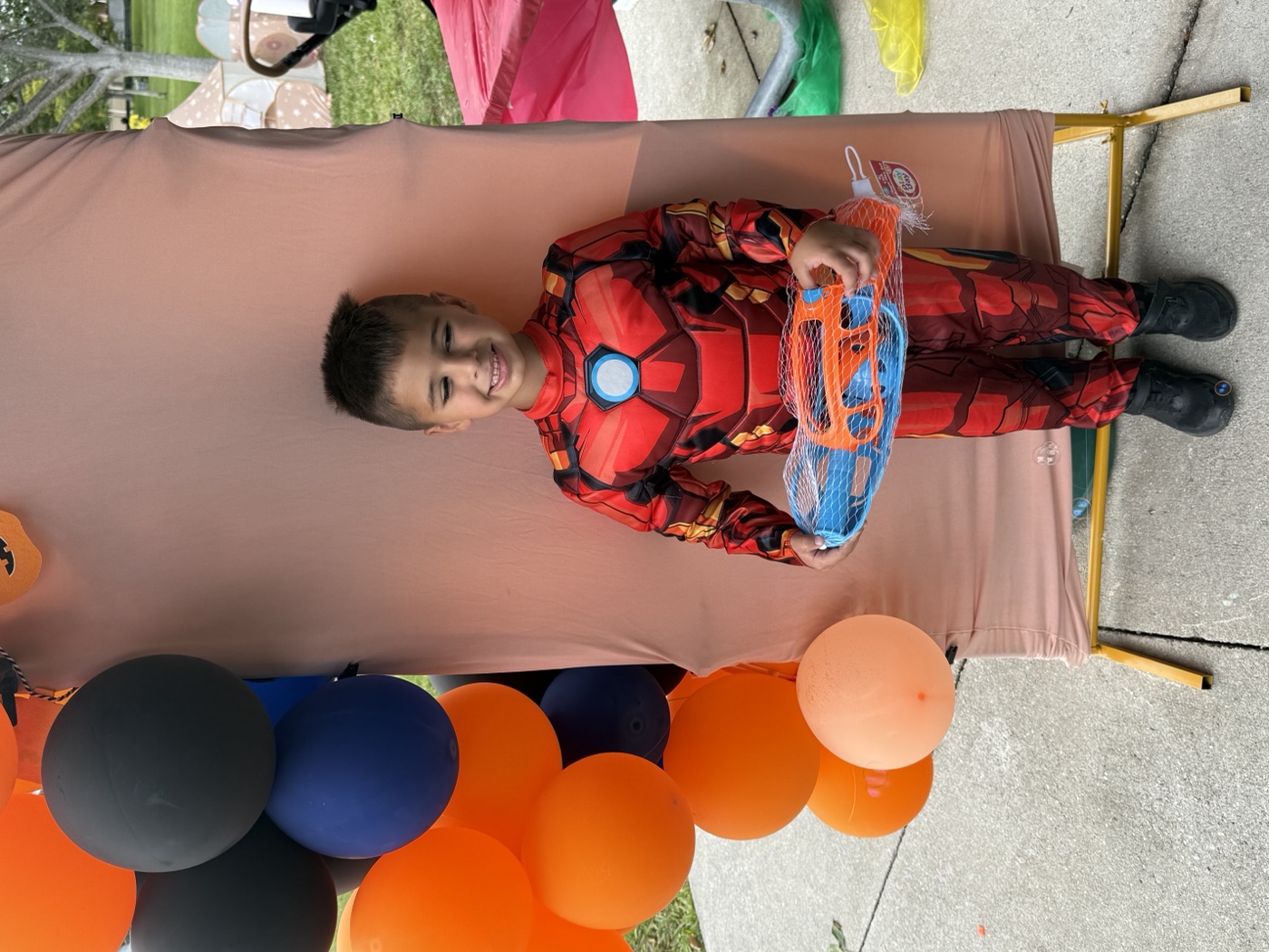 Rainbow balls and rainbow joy — a toddler plays and discovers at our event.