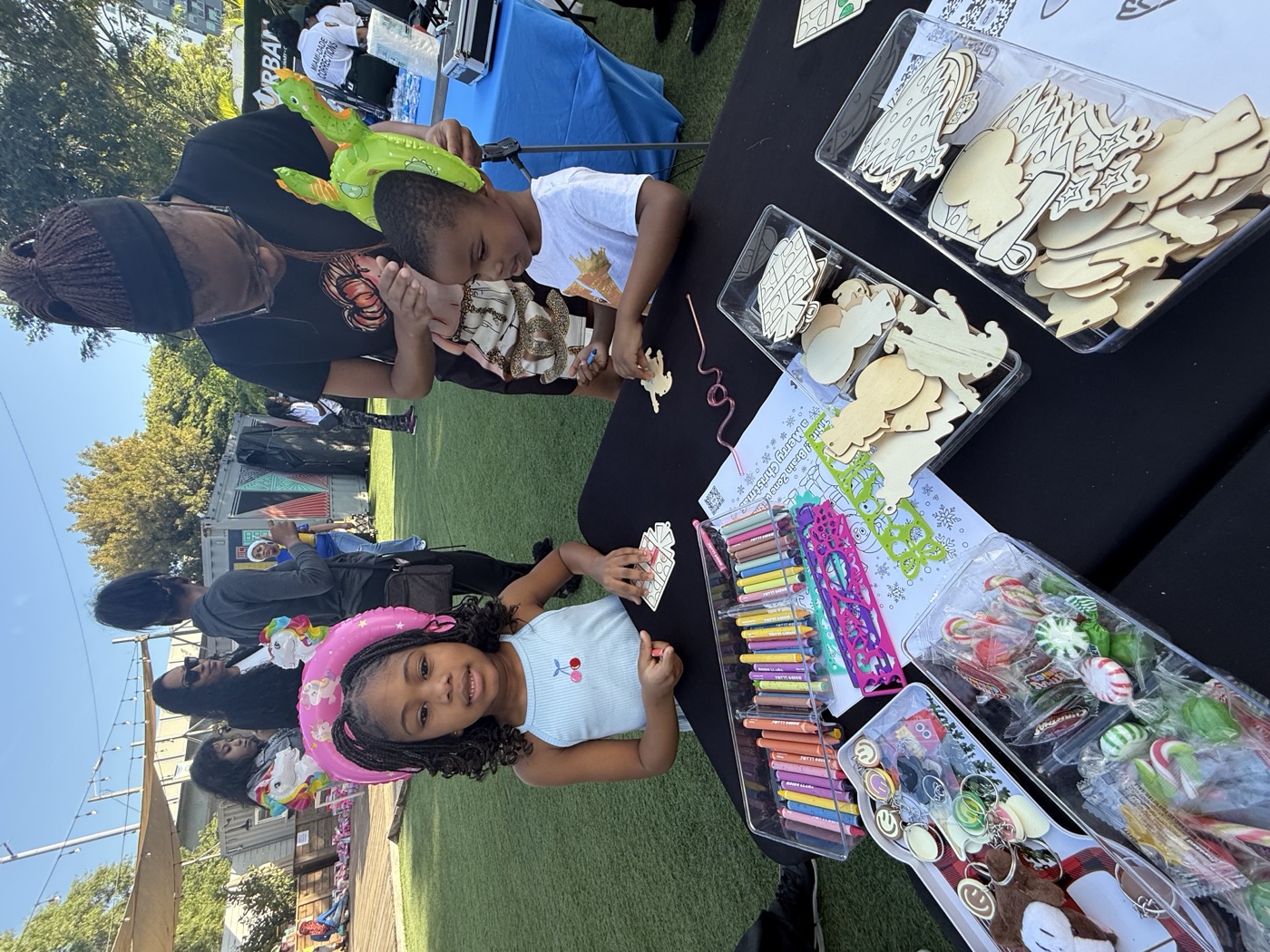 The craft station is always the most popular stop — this little one has the hat 