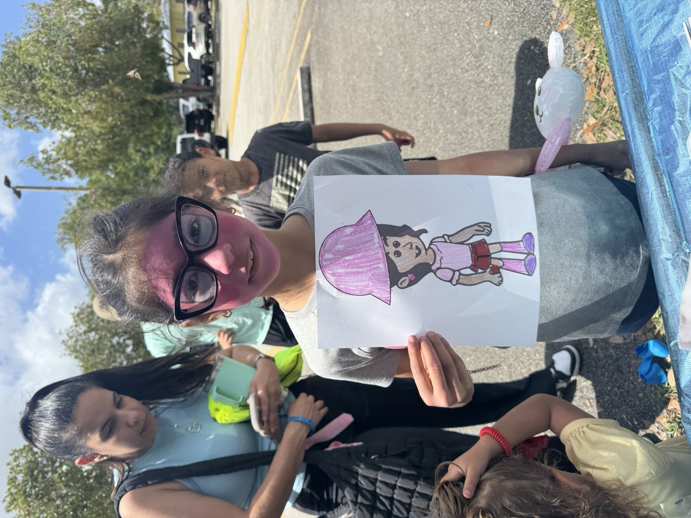 Cool glasses, cool kid — this little artist added their own flair to their color