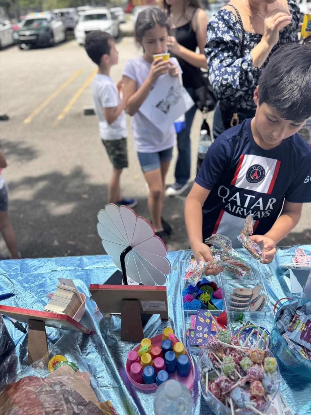 Booth fun at the Think! Brain Zone table — curious kids exploring everything we 