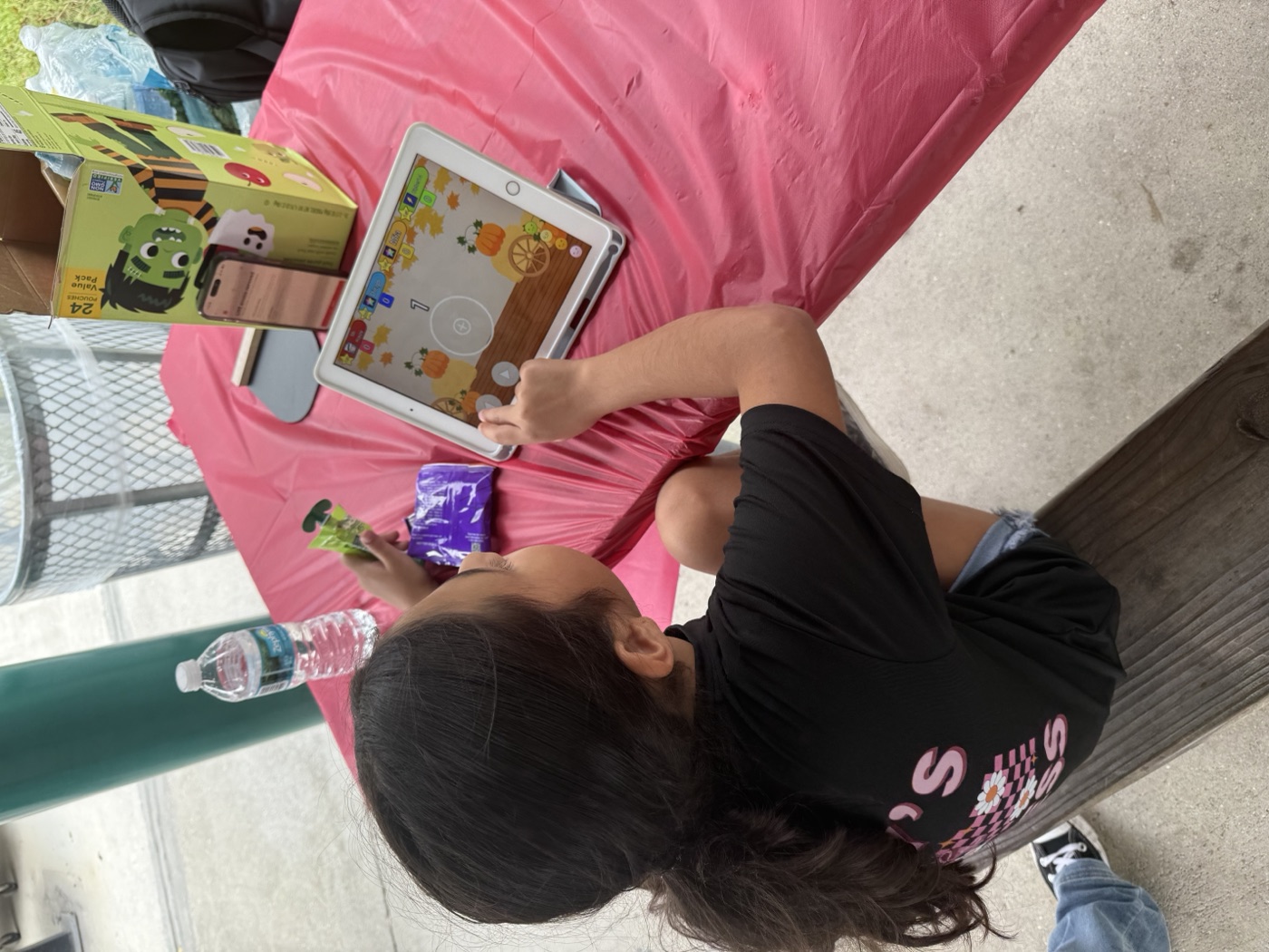 Think! on the go — a child engages with the game at our mobile event station.